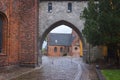 The Absalon Arch between bishop\'s palace and Gothic Roskilde Cathedral, Denmark Royalty Free Stock Photo