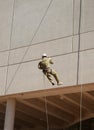 Abseiling down the wall Royalty Free Stock Photo