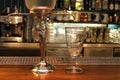 Absinth fountain and glass with spoon on bar counter close-up. Royalty Free Stock Photo