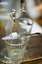 Absinth glass and fountain Royalty Free Stock Photo