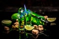 Absinthe poured into a glass. absinthe shots with sugar cubes. Bottle of absinthe and glasses with burning. free space for text. Royalty Free Stock Photo