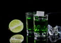 Absinthe shots with lime slices and sugar on black background Royalty Free Stock Photo