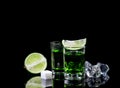 Absinthe shots with lime slices and sugar on black background Royalty Free Stock Photo
