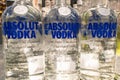 Absolut Vodka logo on some bottles for sale. Absolut a brand of Swedish Vodka produced by the Pernod Ricard corporation. Royalty Free Stock Photo