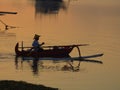 Absolutely beautiful sunrise in Bali. Fisherman going out to work in the morning.