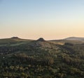 Absolutely stunning landscape image of Dartmoor in England showing Leather Tor, Sharpitor and Kings Tor in majestic sunrise light Royalty Free Stock Photo