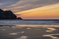 Absolutely stunning landscape images of Holywell Bay beach in Cornwall UK during golden hojur sunset in Spring