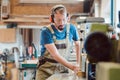 Absorbed carpenter at the milling machine working on wood Royalty Free Stock Photo