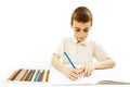 Absorbed little boy drawing with colorful pencils