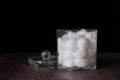 Absorbent cotton balls and cutton sawbs in cotton box with black background Royalty Free Stock Photo