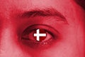 Abstack red human face and the eye with national flag of Denmark