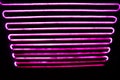 Abstact blurred neon lines on black background. Royalty Free Stock Photo