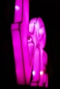 Abstact blurred Plastic pink sign of word LOVE on black background Royalty Free Stock Photo