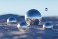 Abstract metal spheres on snow in sunny day. Royalty Free Stock Photo