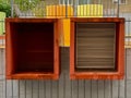 Abstrack architecture wall with two ventilator boxes orange yellow