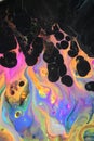 Abstract acrylic pour painting that resembles neon dancing flames. Royalty Free Stock Photo
