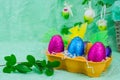 Colorful Easter chocolate eggs and flowers Royalty Free Stock Photo