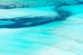 Abstract aerial view of a lagoon with turquoise pristine water Royalty Free Stock Photo