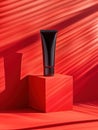 Abstract aesthetic of a black tube on red geometric shapes with dynamic shadows.