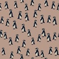 Abstract animal arctic seamless pattern with doodle penguin silhouettes. Beige background