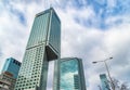 Glass skyscrapers of irregular shape. Bottom view. Abstract architectural detail of corporate building suitable as background Royalty Free Stock Photo