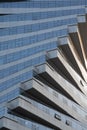 Abstract architecture, modern glass building. Close up view of a spiral modern office building at dusk Royalty Free Stock Photo