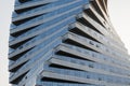 Abstract architecture, modern glass building. Close up view of a spiral modern office building at dusk Royalty Free Stock Photo