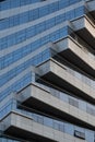 Abstract architecture, modern glass building. Close up view of a spiral modern office building at dusk Royalty Free Stock Photo