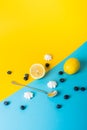 Abstract arrangement with food and different objects on yellow and blue