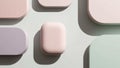 Abstract arrangement of rounded rectangles in pastel tones, including pale pink,
