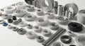 Abstract Array of Precision Engineered White and Metallic Cylindrical and Ring Shaped Components on White Surface with Royalty Free Stock Photo