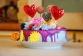 Happy Valentine party: delicious and beautiful cake with sweets and small donuts