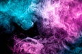 Abstract art colored blue and pink smoke on black isolated background. Royalty Free Stock Photo