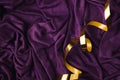 Abstract art concept purple silk or saten backround with golden ribbon. Party of birthday idea with copy space Royalty Free Stock Photo