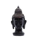 An abstract art containing close up of Black Buddha sculpture against white background Royalty Free Stock Photo