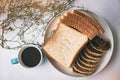 The abstract art design background of  blue ceramic coffee cup put beside sliced bread dish,on white desk Royalty Free Stock Photo