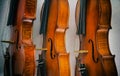 The abstract art design background of three violins stacked on background.show side of wood on violin,vintage and art style