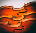 The abstract art design background of violins stacked on board,show half front side of violin,in dramatic tone, vintage and art st Royalty Free Stock Photo