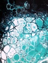 Liquid acrylic painting, imitation water babbles, wave, foam, sea. Blue, turquoise and black paint