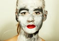 Abstract art makeup. Face and neck girls smeared with gray colors and bright red lips. Holi Festival Royalty Free Stock Photo