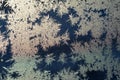 It is a pattern of frost on the glass of a window. White textured frosty crystal snowflake. Natural frost floral pattern with abst