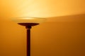 Art view of a modern pole lamp casting light upon a wall corner Royalty Free Stock Photo