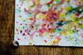 Abstract art of vivid bright colorful watercolor splash and drops on the white paper Royalty Free Stock Photo