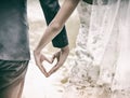 The abstract artdesign background of wedding couple is making love hand sign together,heart sign with hand,symbol of love,warm lig