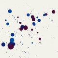 Abstract artwork featuring blue and purple ink splatters on white textured paper. The Royalty Free Stock Photo