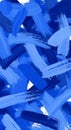 Abstract artwork featuring dynamic strokes of blue paint in various shades. The Royalty Free Stock Photo