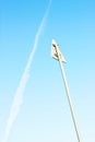 Abstract backdrop with warning sign on the background of decline of airplane track in the sky