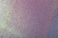 Abstract background with artificial leather. Stock macro texture. Imitation of iridescent scales