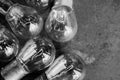 Abstract background black and white image, several small light bulbs light selective focus