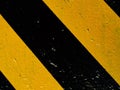 Abstract background. Black yellow oblique stripes. Industrial background. Royalty Free Stock Photo